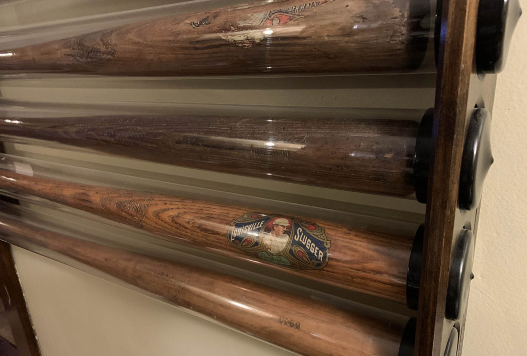 Baseball bats in storage tubes