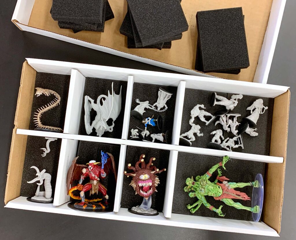 Miniatures in BCW card sorting box with monster pads