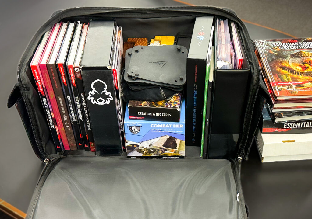 Spectrum Board Game Bag with several D&D books and accessories