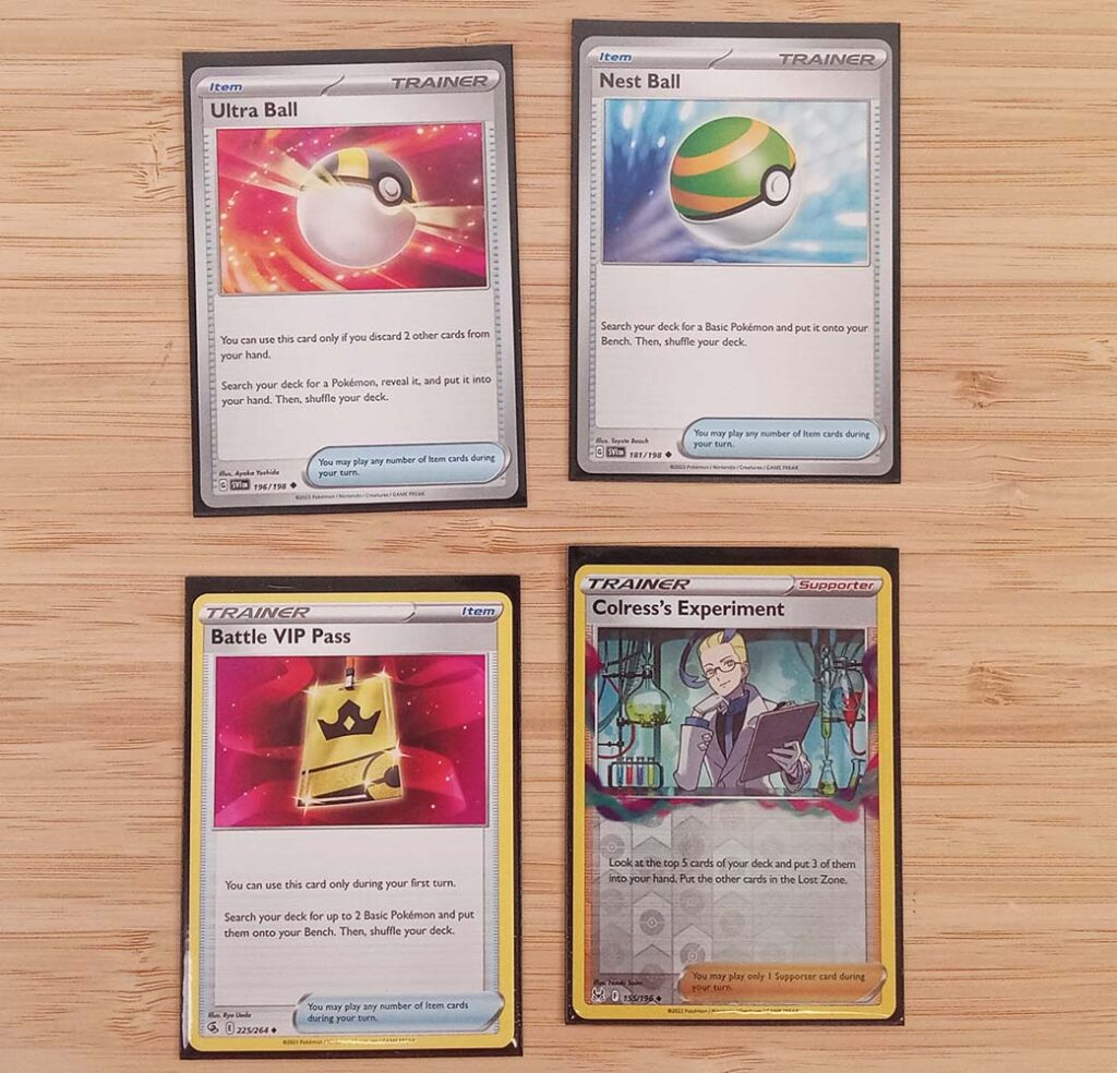 Ultra Ball, Nest Ball, Battle VIP Pass, and Colress's Experiement cards for the Pokemon tcg