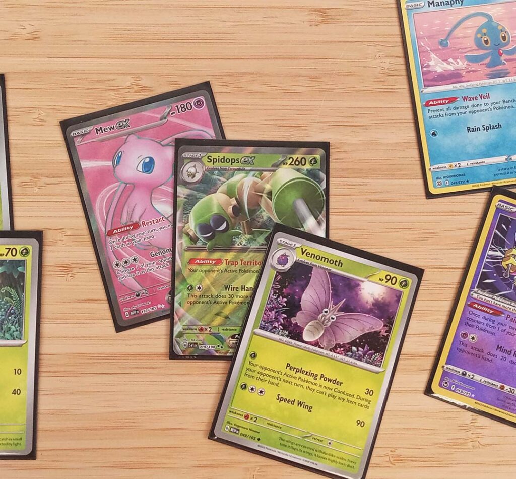 Mew ex, Spidops ex, and Venomoth cards for the Pokemon tcg