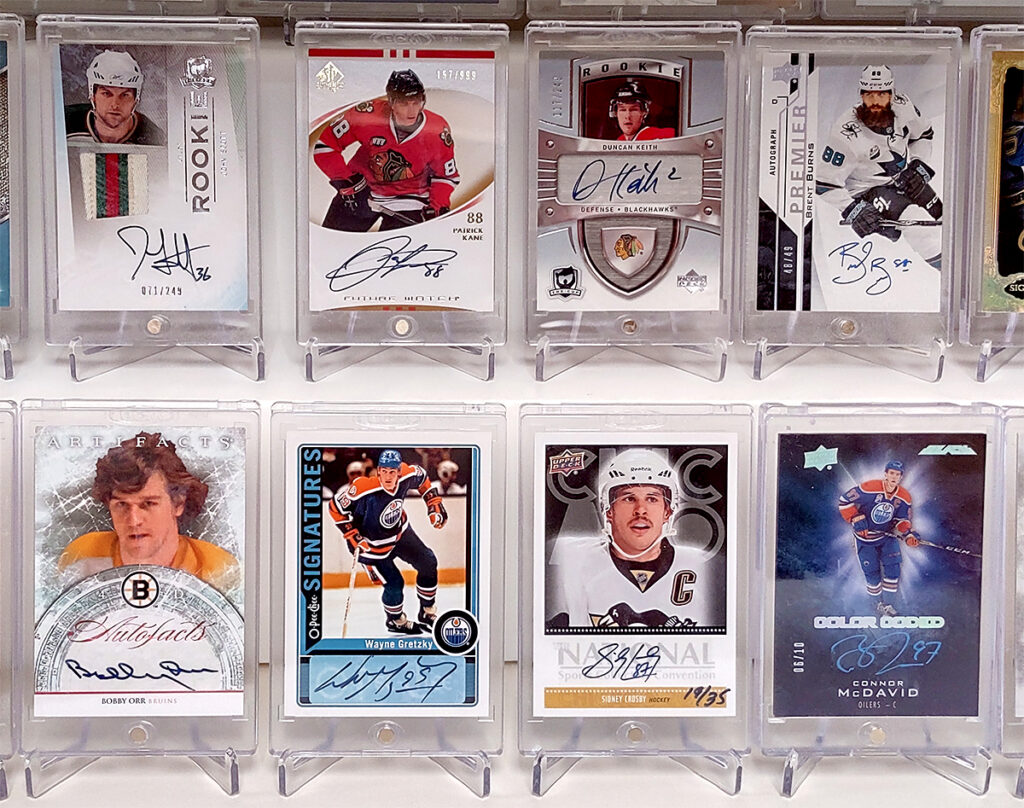 Display of hockey cards in magnetic holders with card stands.