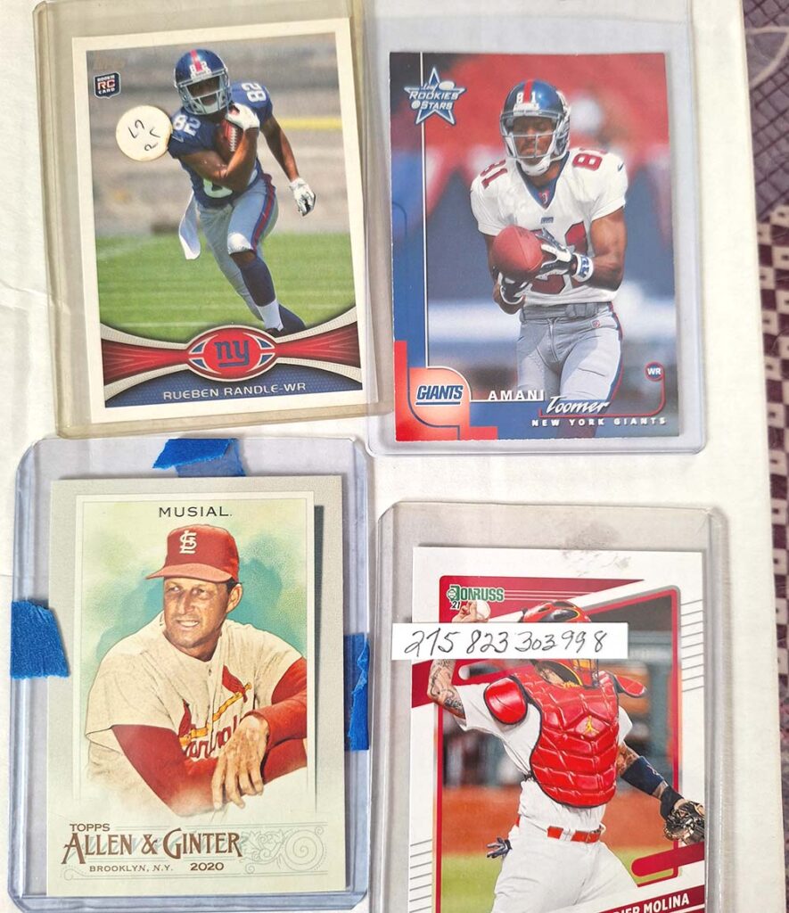 Various cards in old and dirty toploaders.