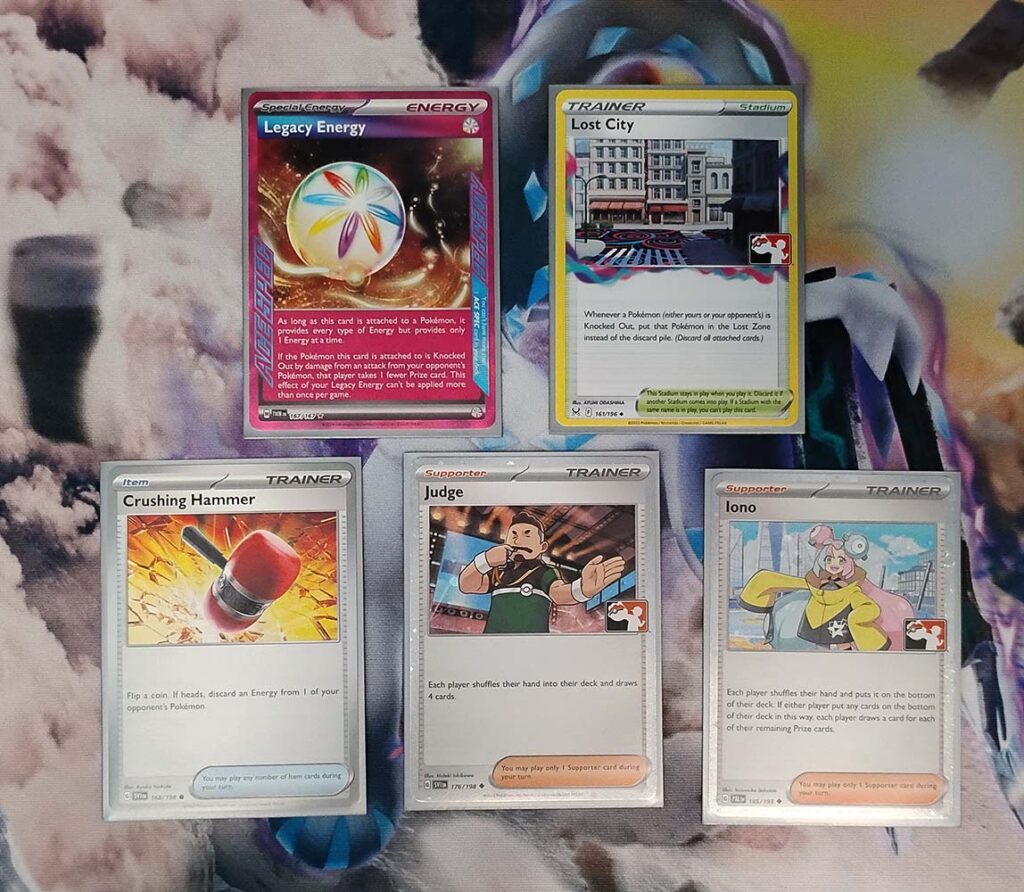 Legacy Energy, Lost City, Crushing Hammer, Judge, and Iono cards for the Pok&eacute;mon TCG